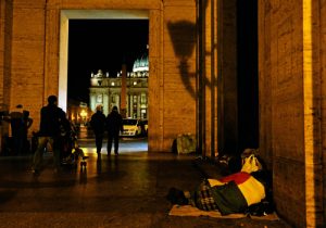 Homeless person sleeps outside Vatican press office near St. Peter's Square
