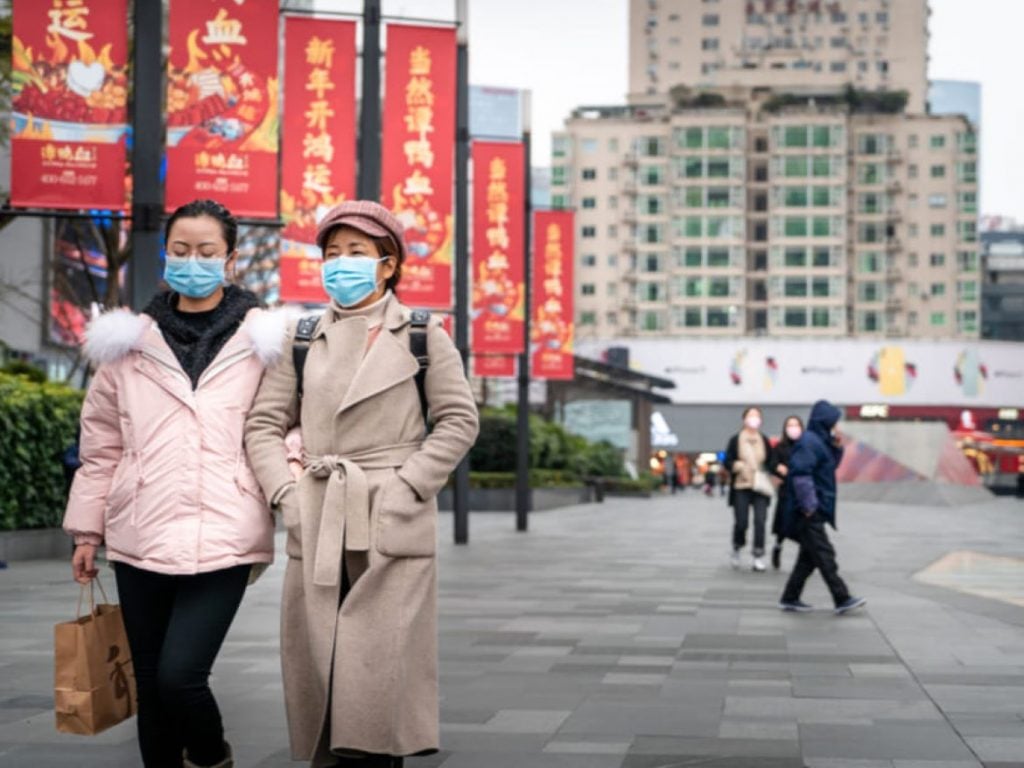Coronavirus Epidemic In China .People Wearing Face Masks Shutterstock