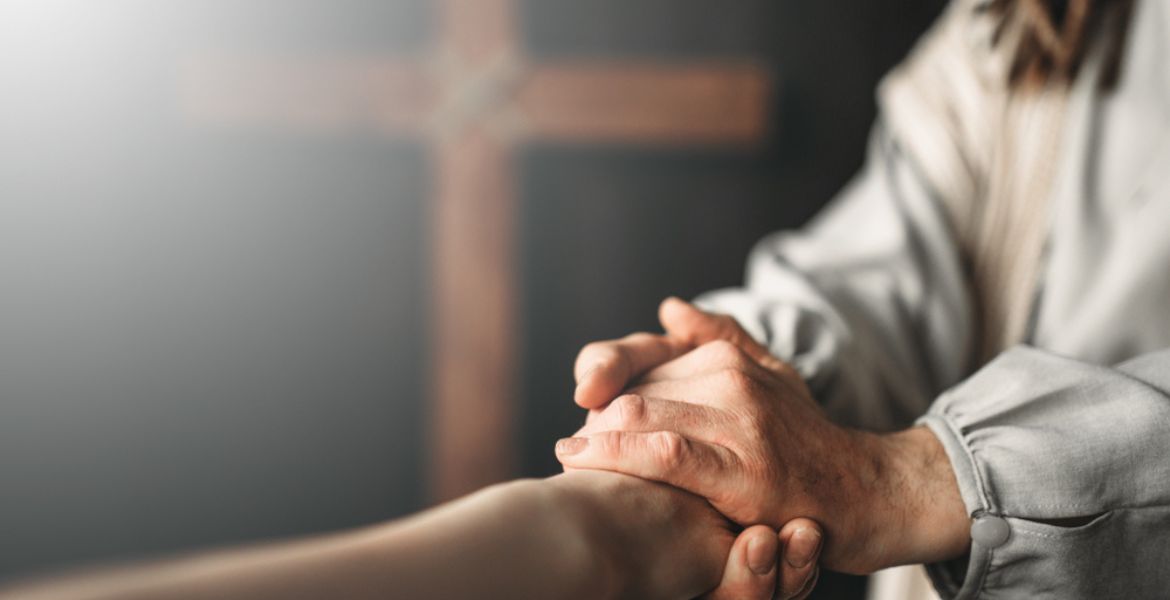 Jesús tomando la mano de una persona
