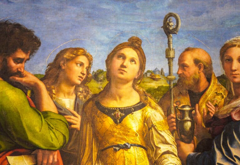 Santa Cecilia aparece rodeada de varias personas. La santa mira al cielo.