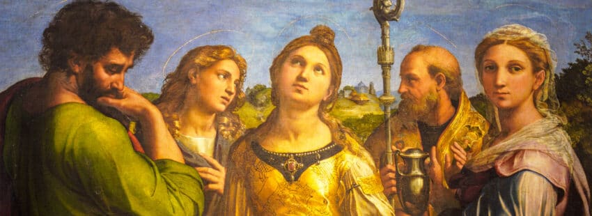 Santa Cecilia aparece rodeada de varias personas. La santa mira al cielo.